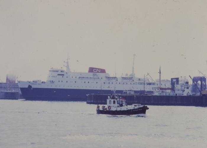 tug boat sailing away from the ambrose shea