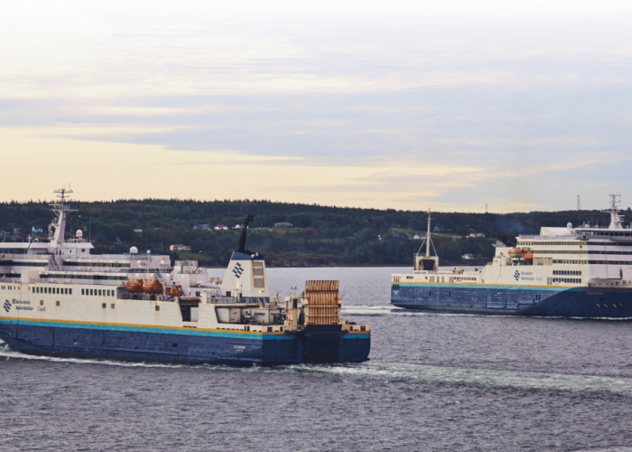 two commercial marine atlantic vessels sail alongside each other