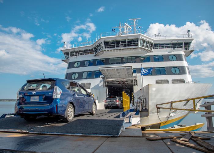 Blue prius drives onto the vessel