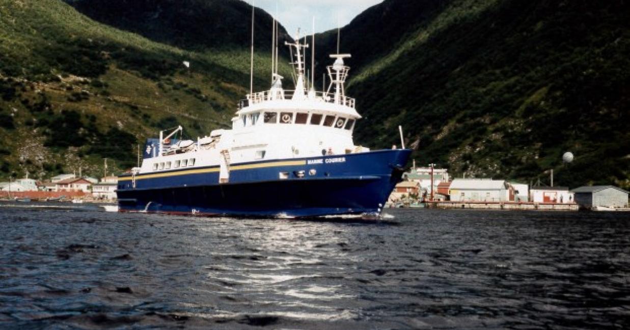 courier sailing away from shore