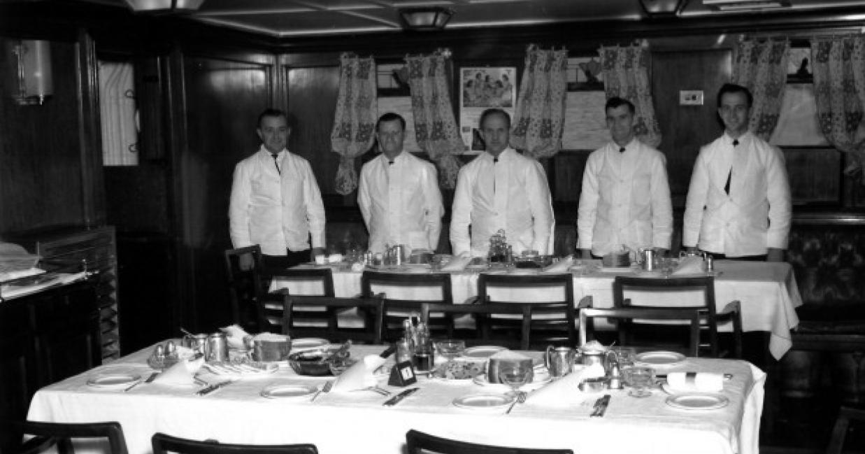 dining deck with the cooks in the background