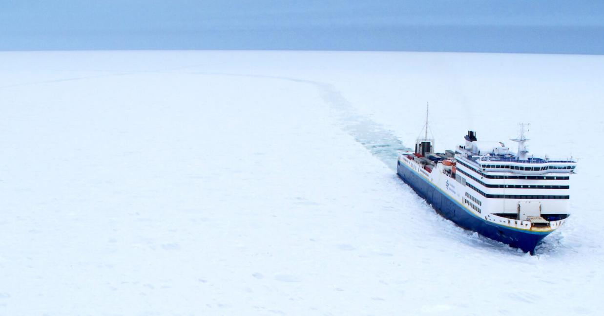 vessel travelling through snow covered ocean