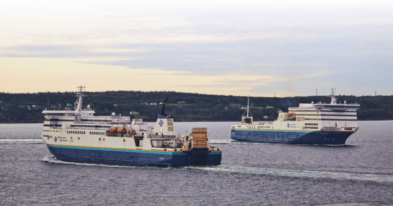 two commercial marine atlantic vessels sail alongside each other