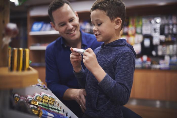 Little Boy Picking Out Candy Bar