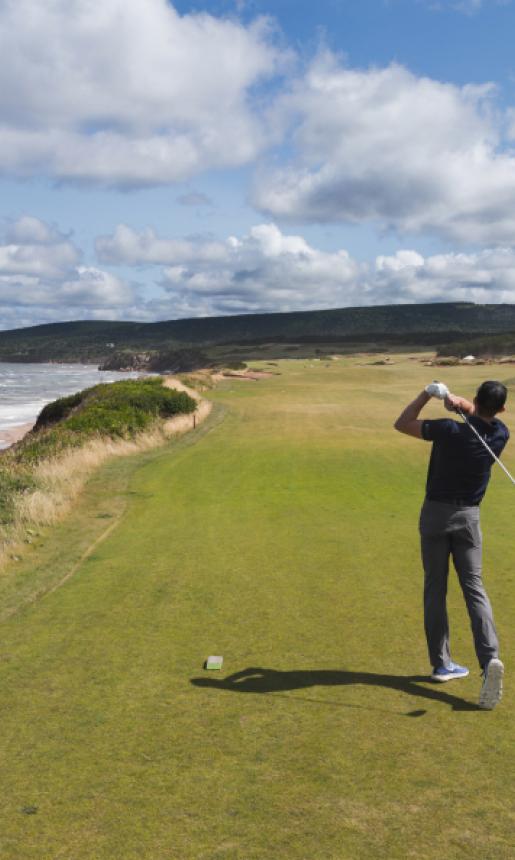 golfer along coastline of cape breton