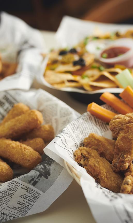 mozza sticks, chicken wings, nachos, and onion rings