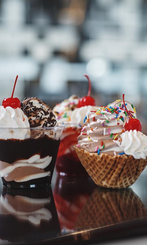 ice cream sundaes with cherries on top