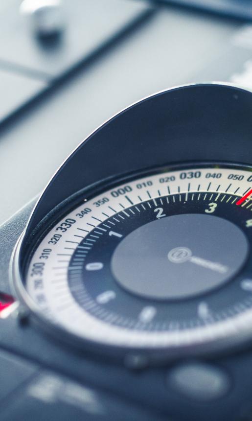 Close up view of a sailing navigational dial.