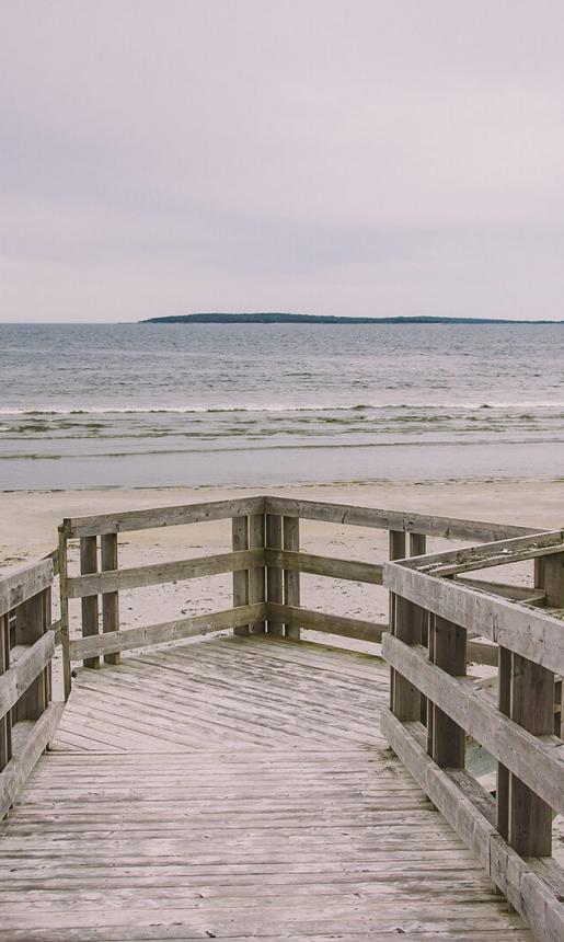 Boardwalk leading to beautiful sandy beach.