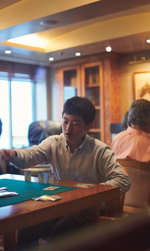 People playing cards at a table